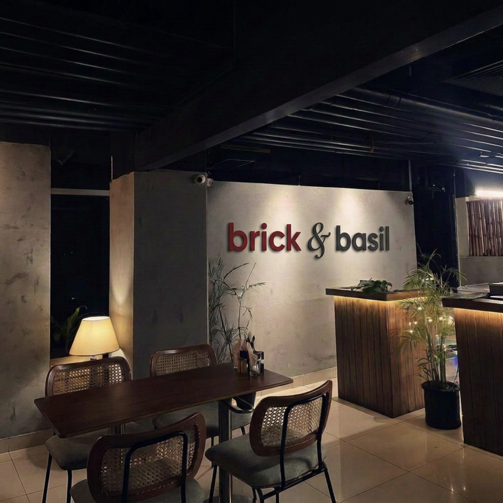 Warm brick-walled dining room at Brick & Basil